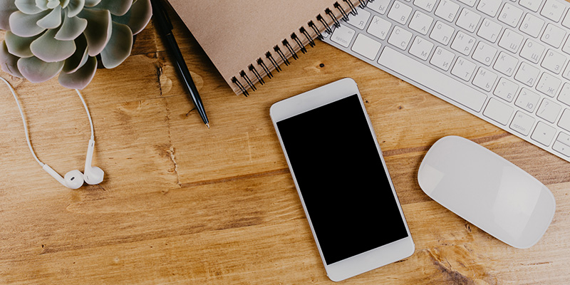 Cell phone on desk.