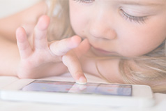 Kid playing game on cell phone
