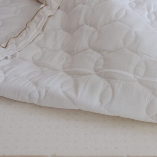 Wrapped layer of latex placed in a Savvy Rest organic cotton casing.