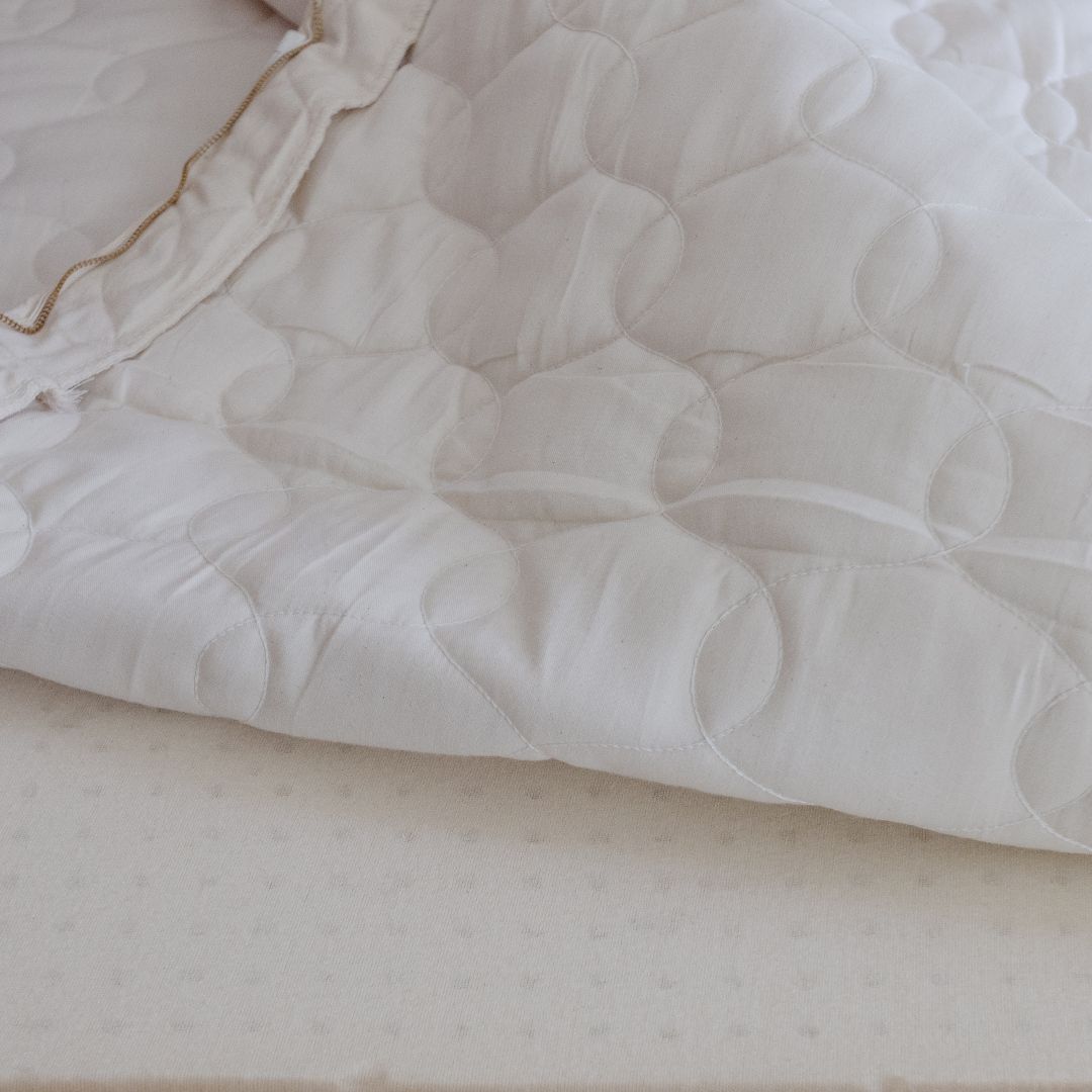 Wrapped layer of latex placed in a Savvy Rest organic cotton casing.