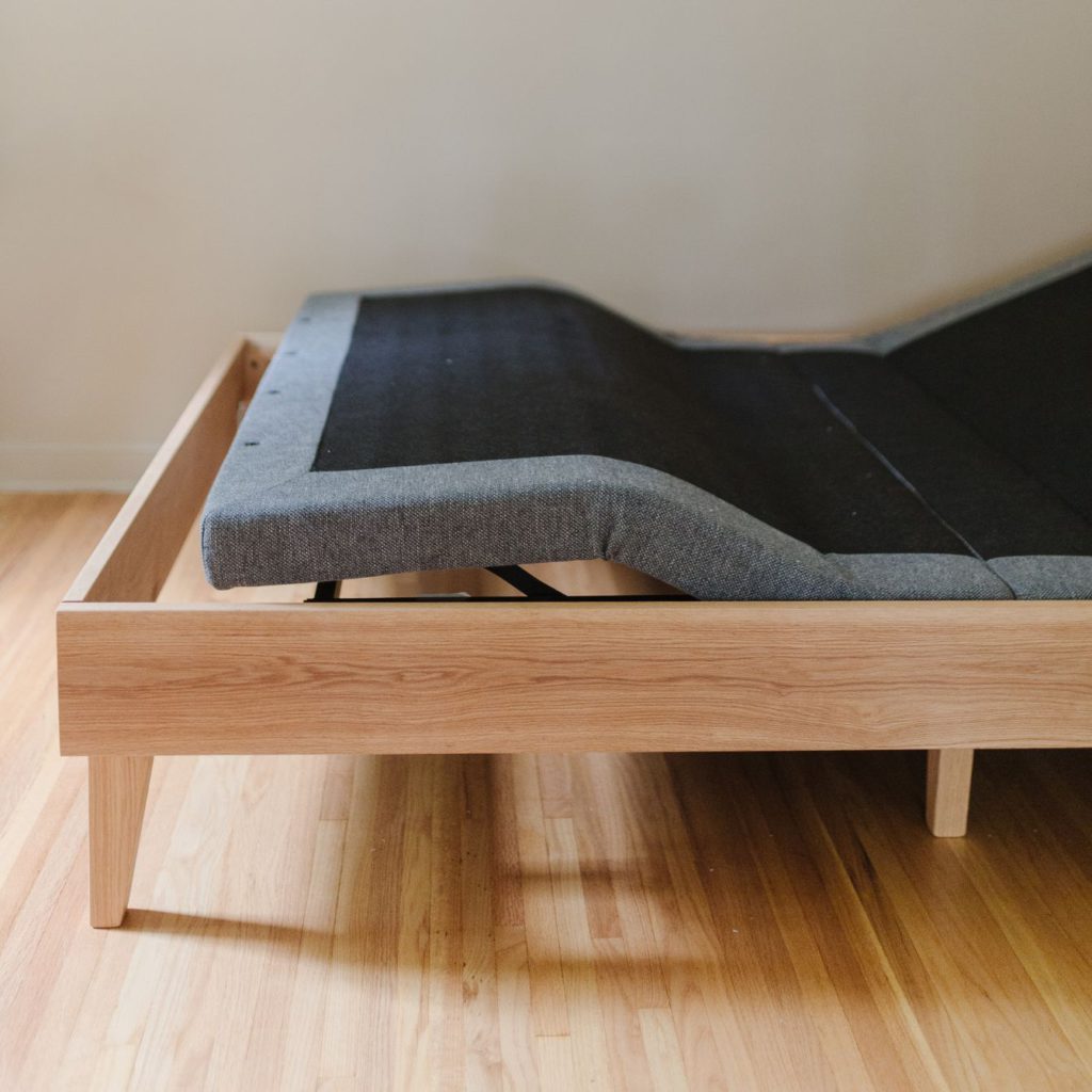 Adjustable bed frame with store headboard and footboard