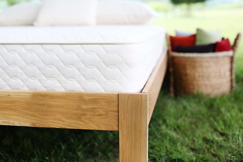 Innerspring mattress on a natural platform bed