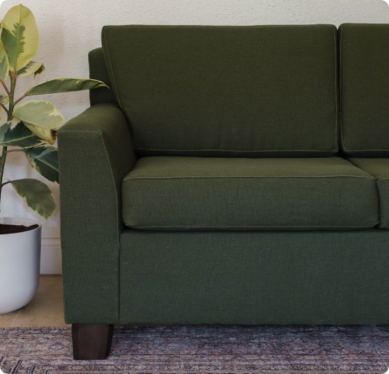 Organic armchair beside a window with natural light