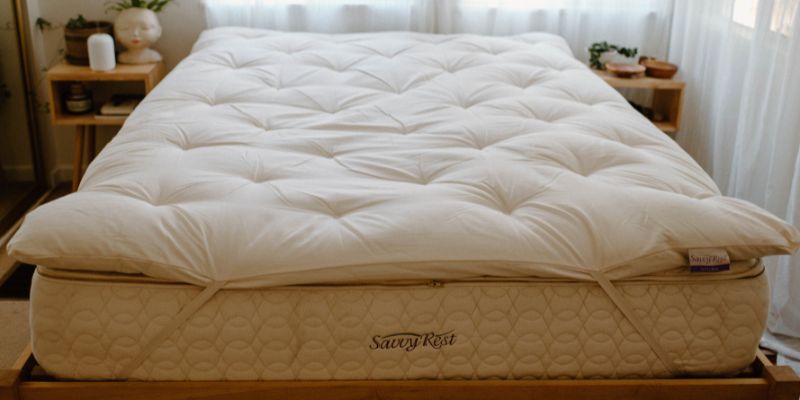 Savvy Rest mattress and Savvy Woolsy mattress topper in styled bedroom.