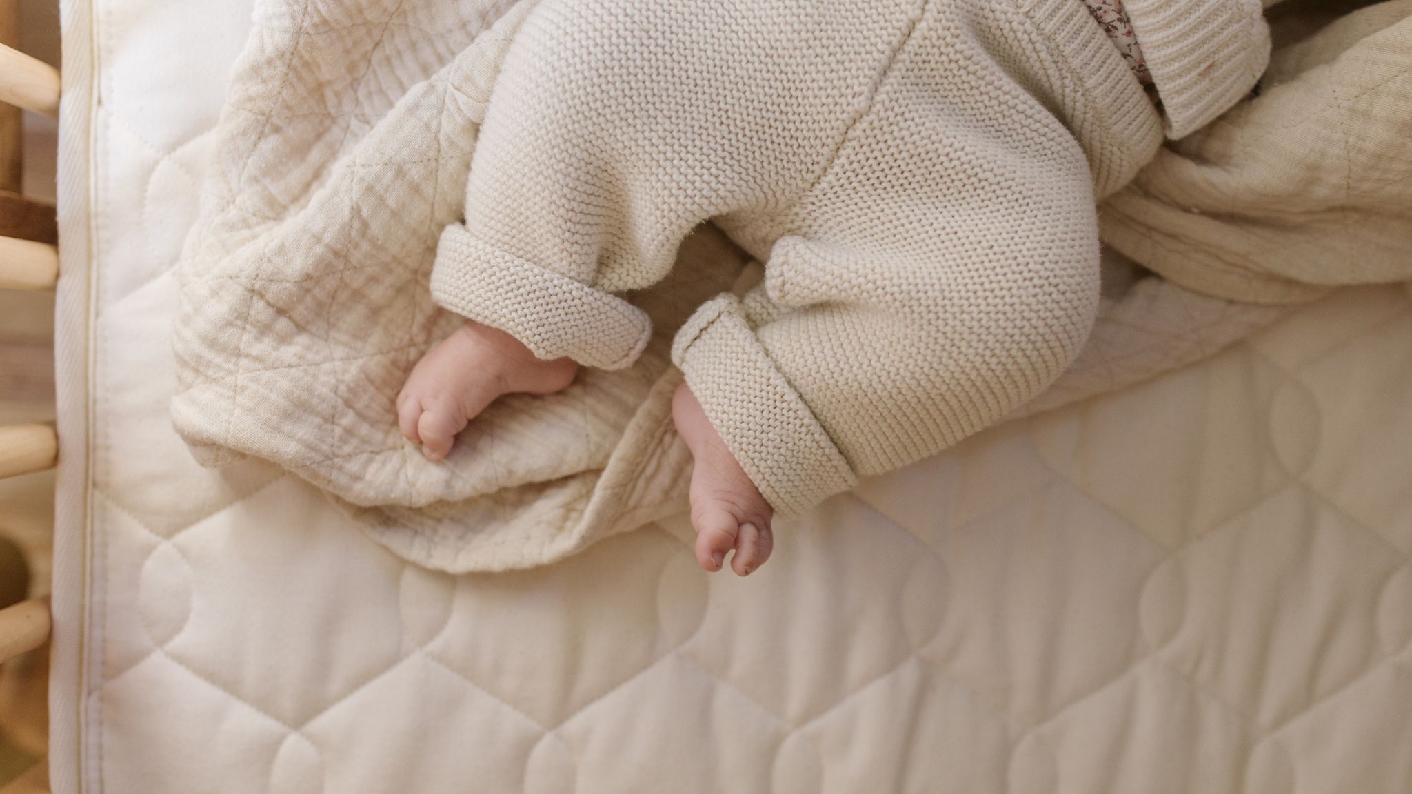 Baby on organic crib mattress