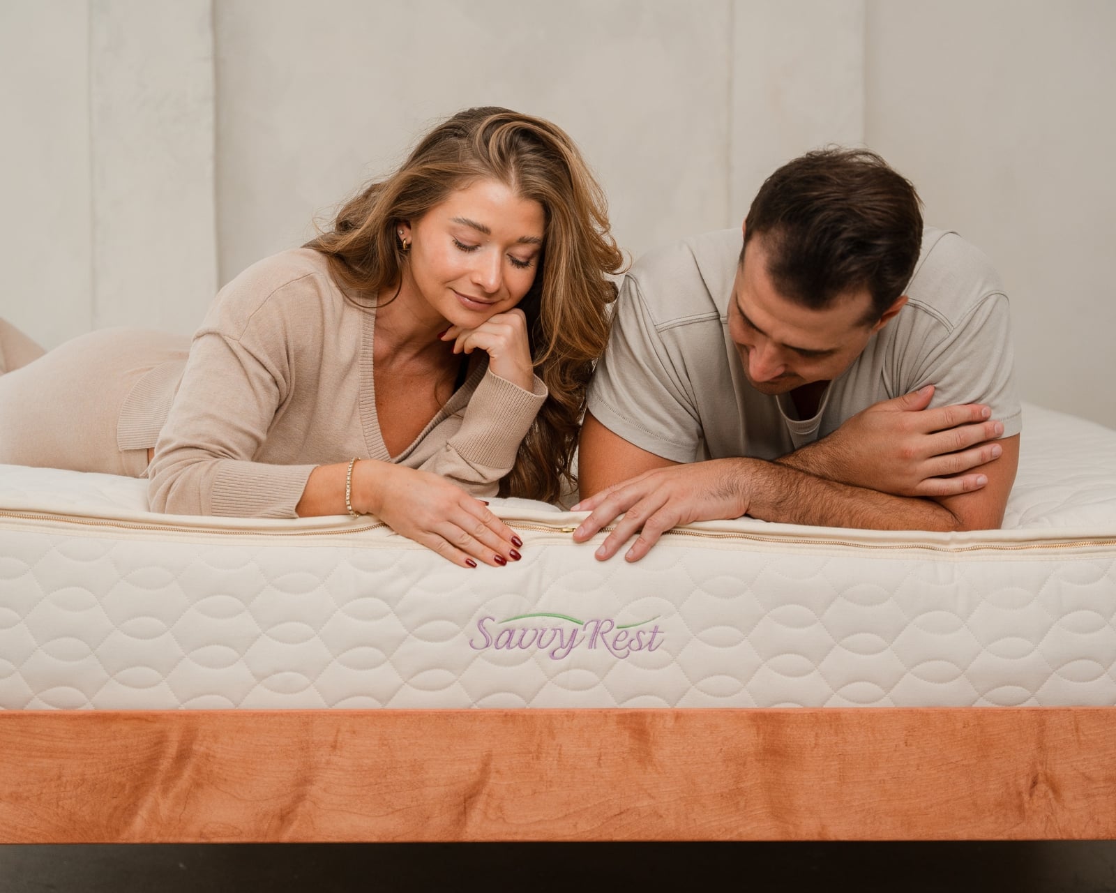 A couple resting on a Savvy Rest Serenity organic latex mattress