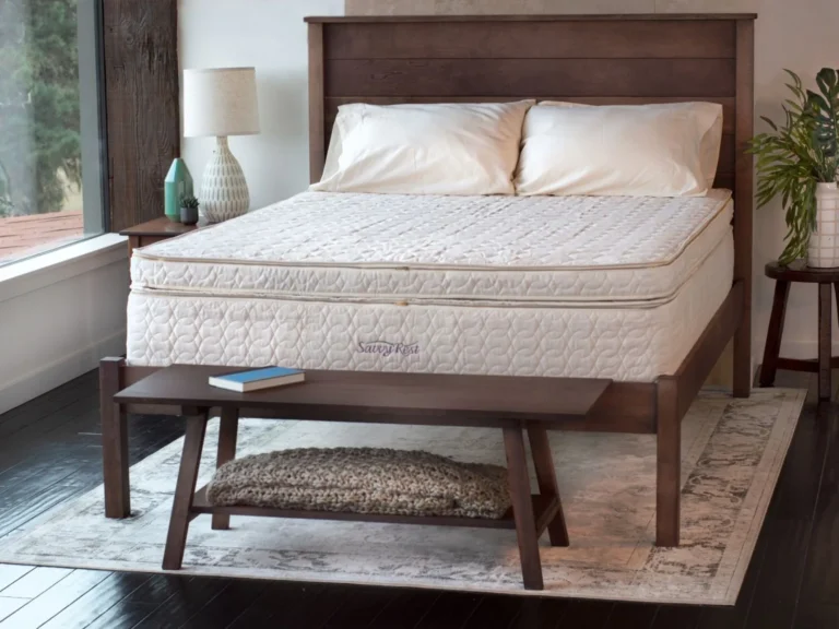 Savvy Rest mattress on a wooden bed in a bright bedroom
